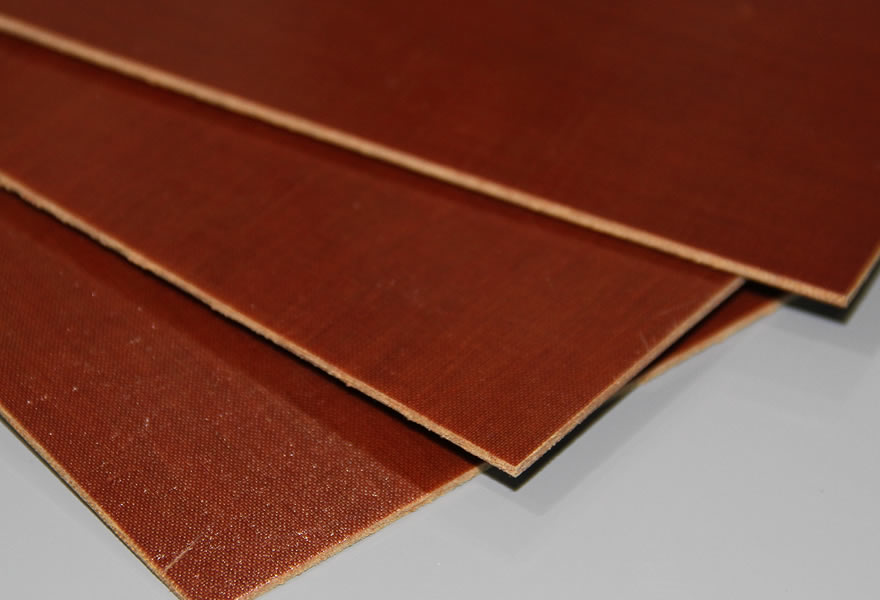 What are the heat and voltage resistance of phenolic cotton cloth board?
